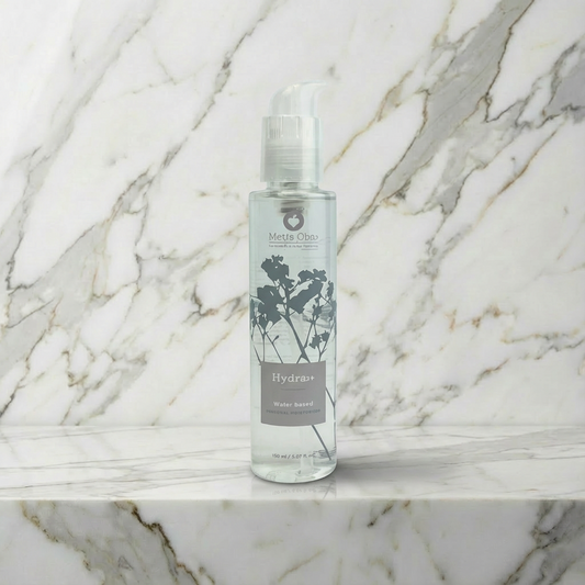 Close-up van Hydra+ glijmiddel pompje met productlabel en ingrediënten informatie