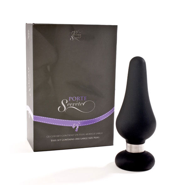 Buttplug in luxe doosje, zwarte siliconen buttplug naast donkergrijze geschenkdoos met paars lint.