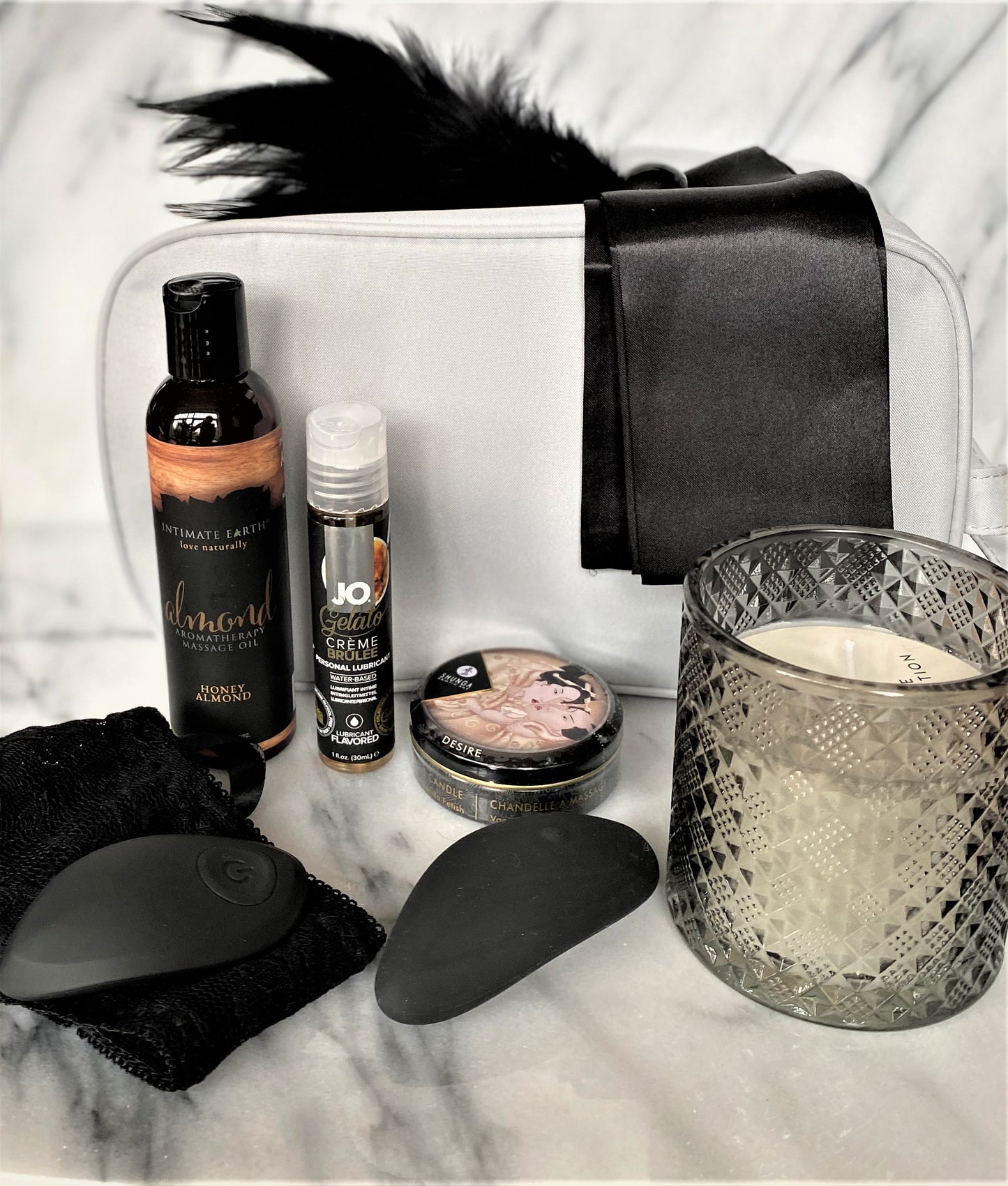 Sensuele geschenkset met massage-olie, glijmiddel, kaars, blinddoek, veertje en vibrators