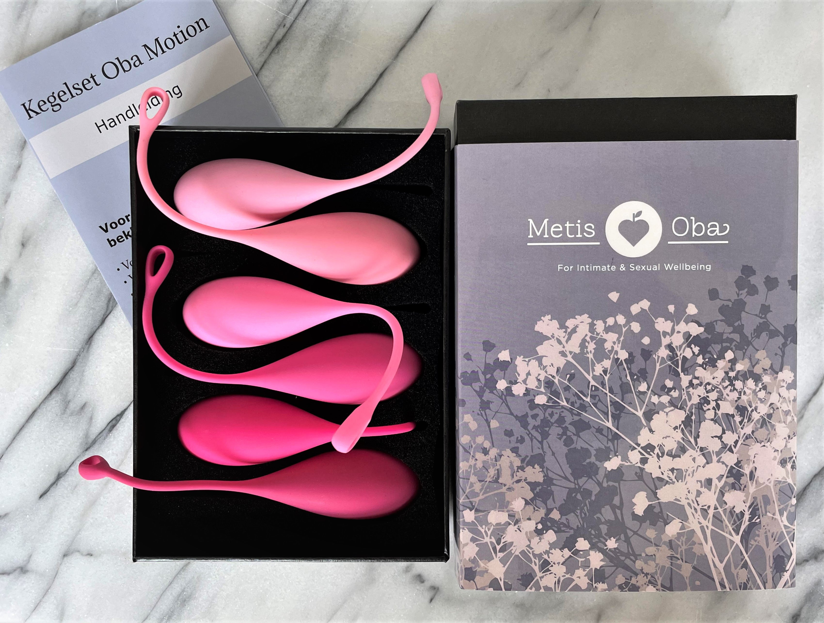 Kegelset Oba Motion van De Paarse Keizerin met drie roze siliconen ballen op witte achtergrond