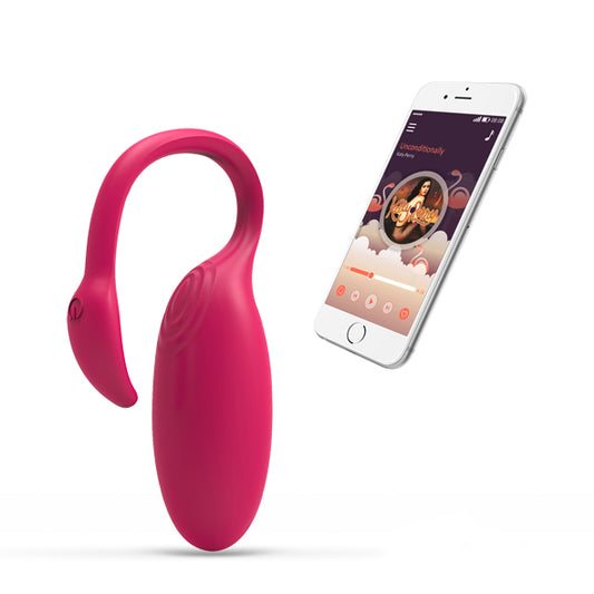Roze Magic Motion Flamingo vibrerend ei naast smartphone met muziekspeler-app