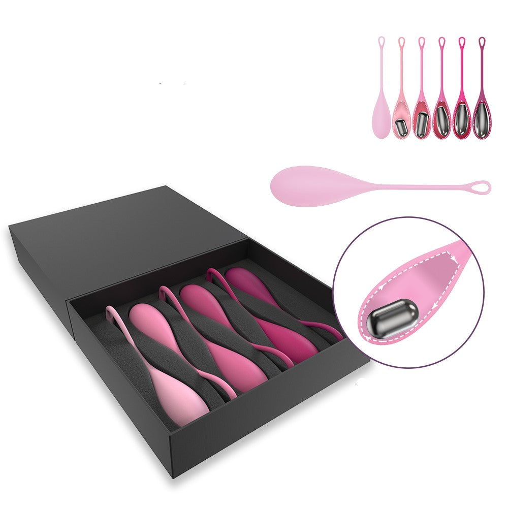 Zijaanzicht van roze kegeltrainer Oba Motion met verschillende gewichten voor bekkenbodemspieren