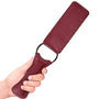 Zijaanzicht van bordeauxrode lederlook paddle met ergonomische handgreep