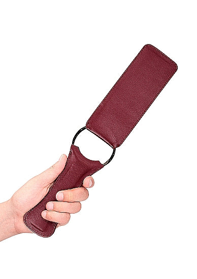 Zijaanzicht van bordeauxrode lederlook paddle met ergonomische handgreep