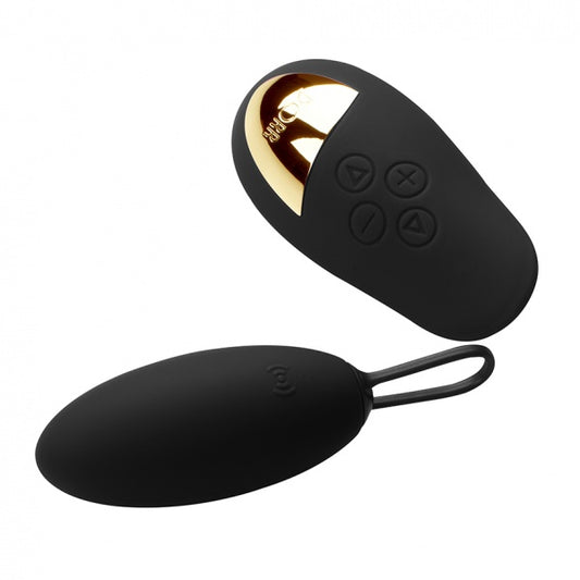 Paarse Spot vibrator met alle meegeleverde accessoires uitgestald op neutrale achtergrond