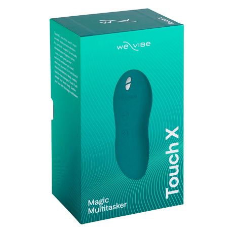 Sfeervolle opstelling oranje We-Vibe Touch X stimulator in intieme setting