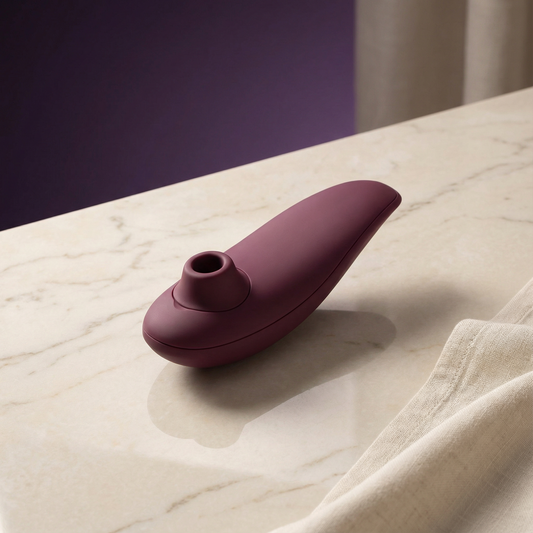 Close-up van Womanizer Classic 2 bedieningsknoppen en hoogwaardige zwarte afwerking